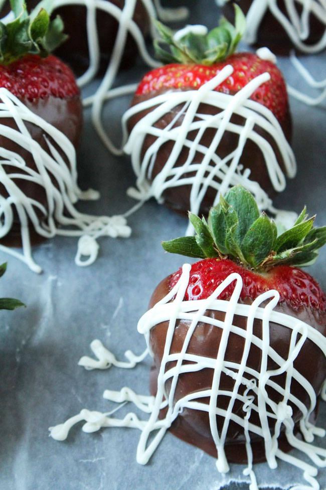 Fresh strawberries dipped in dark chocolate and drizzled with melted white chocolate.