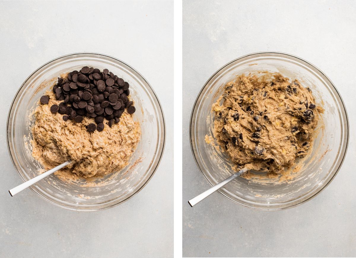 Stirring chocolate chips into muffin batter in a glass mixing bowl.