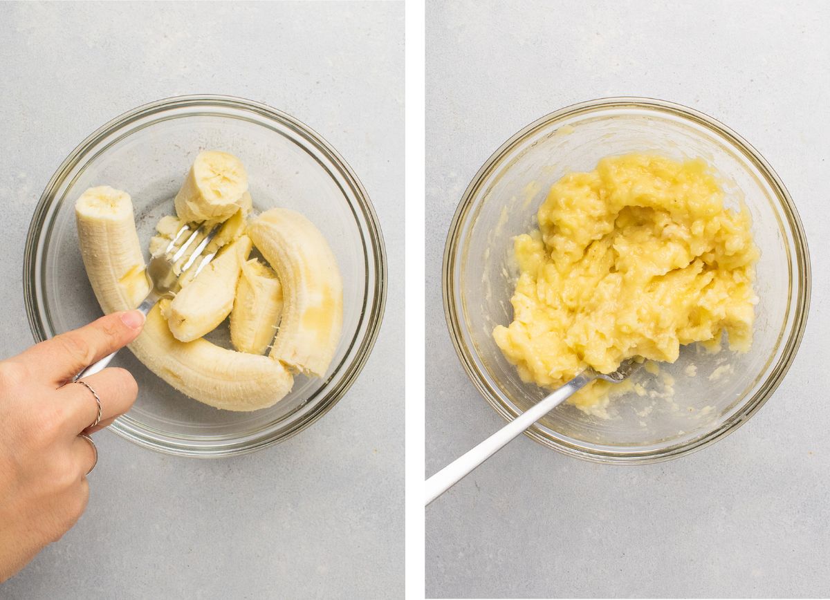 Mashing bananas in a small glass bowl with a silver fork.