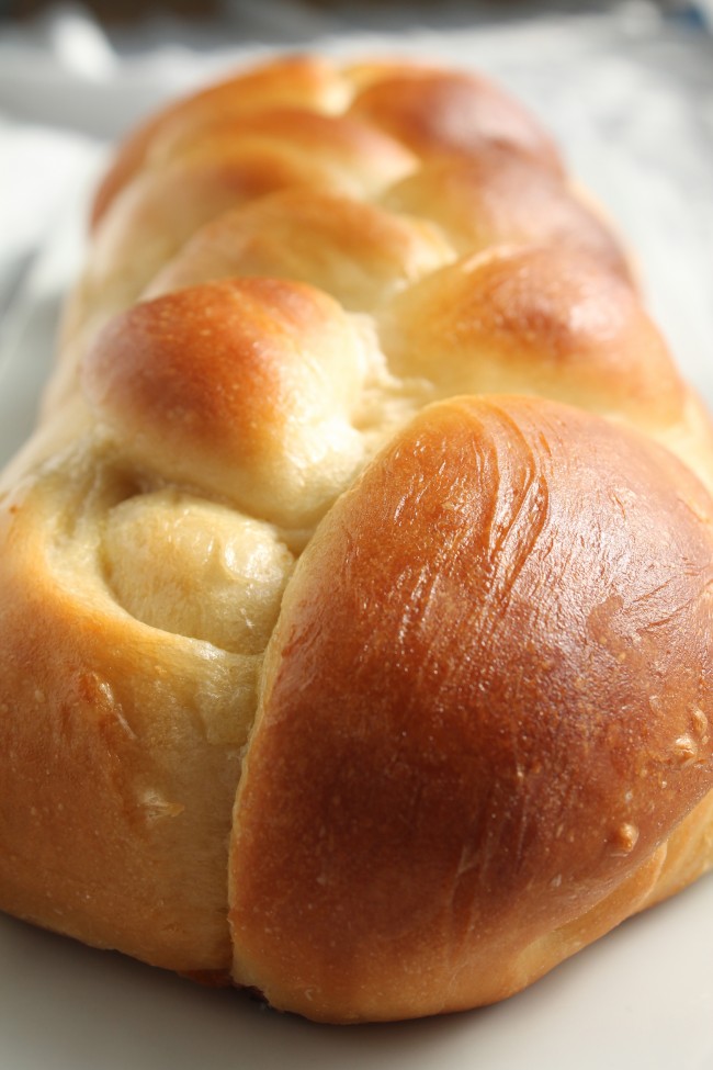 Close up of a fresh loaf of challah bread.