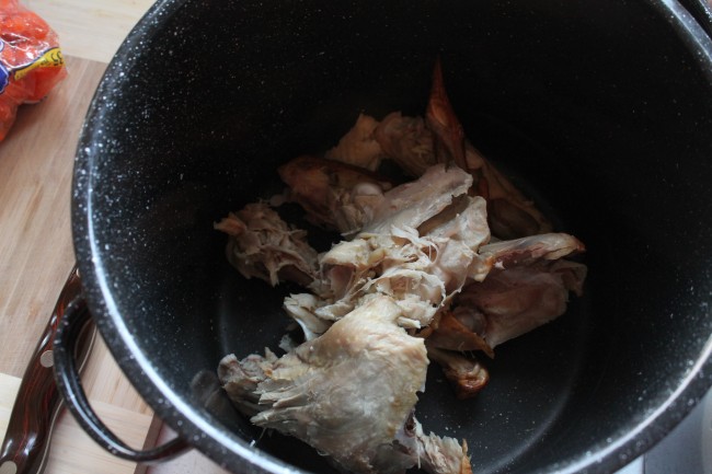 Turkey bones in a large black saucepot.