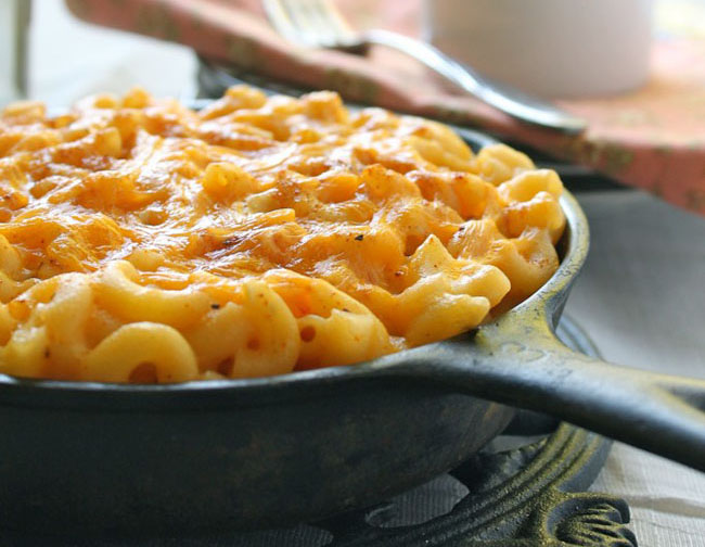 Macaroni and cheese in a cast iron skillet.