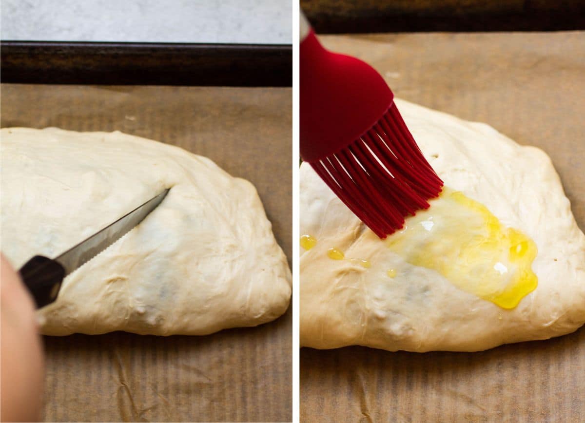 Red silicone pastry brush spreading olive oil over calzone dough.