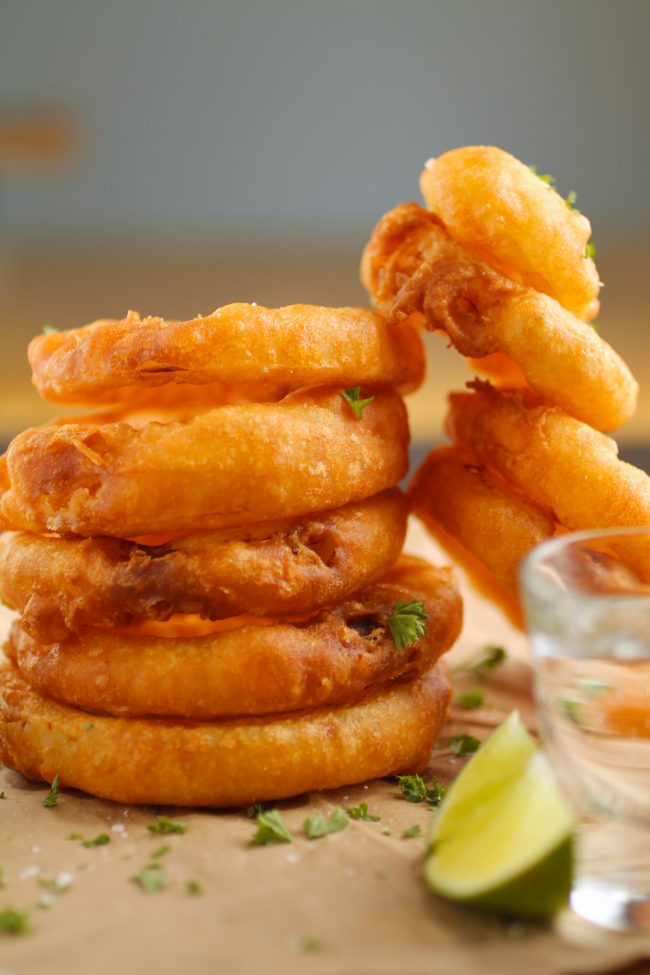 Close up of a stack of onion rings.