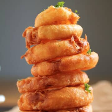 Onion rings arranged in a stack.