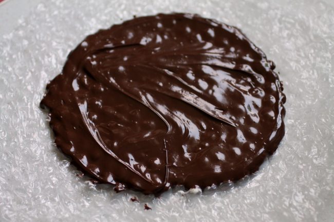 Melted chocolate spread over a piece of food-safe bubble wrap.