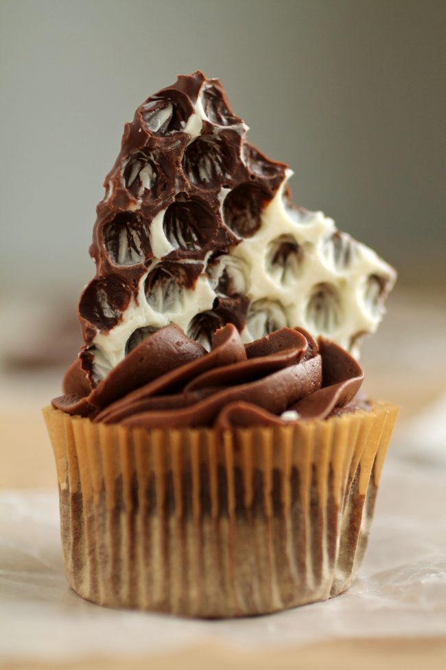 Chocolate cupcake topped with chocolate bark.