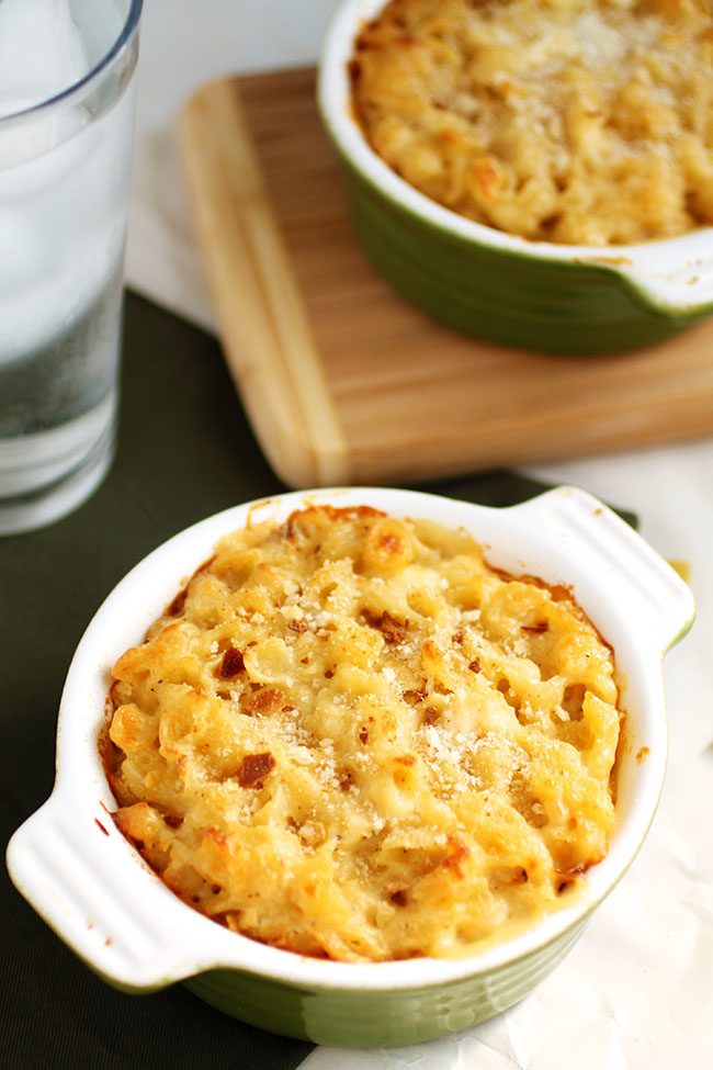 Two small baking dishes filled with baked mac and cheese.