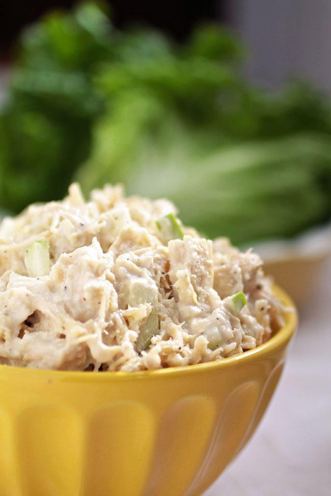 Chicken salad in a yellow bowl.