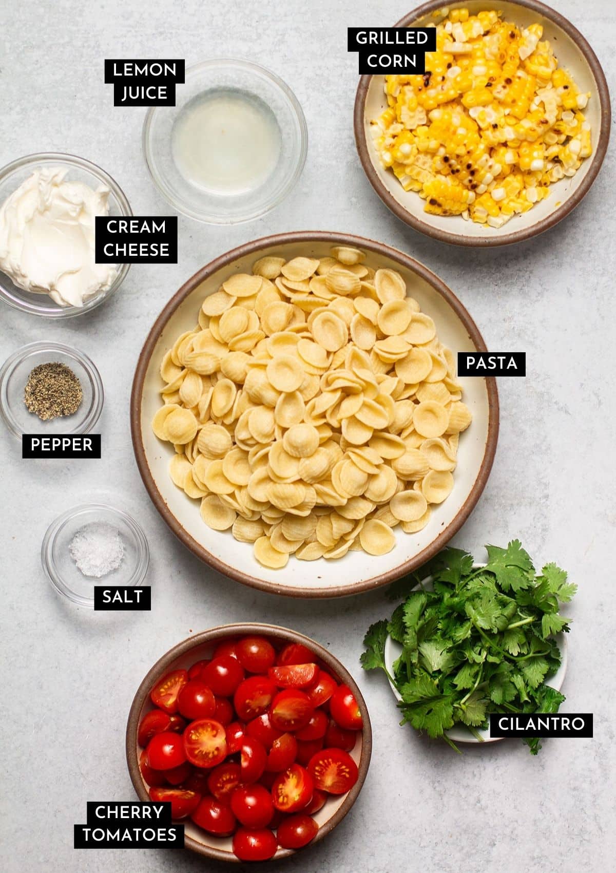 Pasta ingredients, measured into individual bowls.