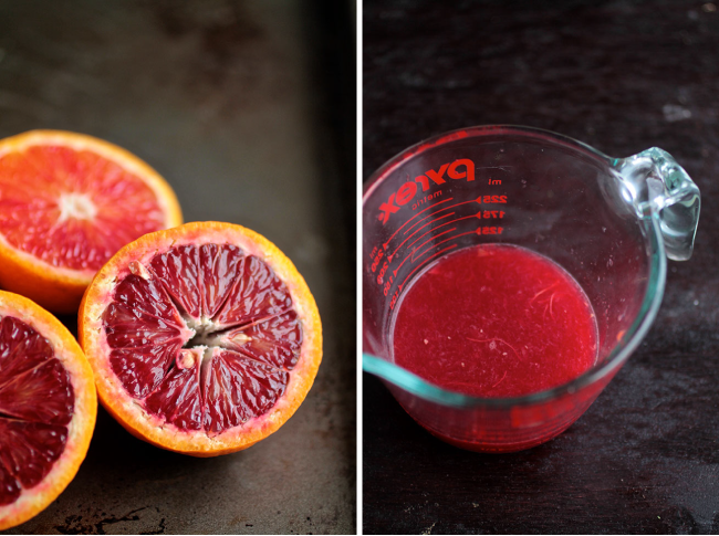 Measuring cup filled with dark red juice from blood oranges.