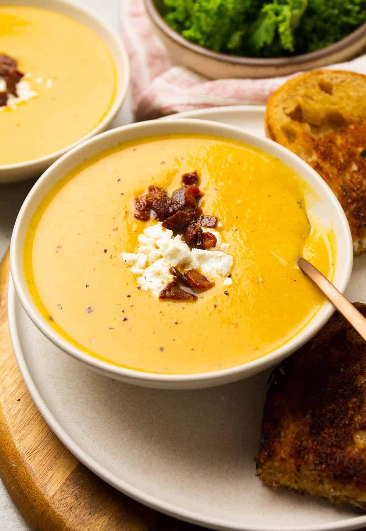 Squash soup topped with bacon and goat cheese.