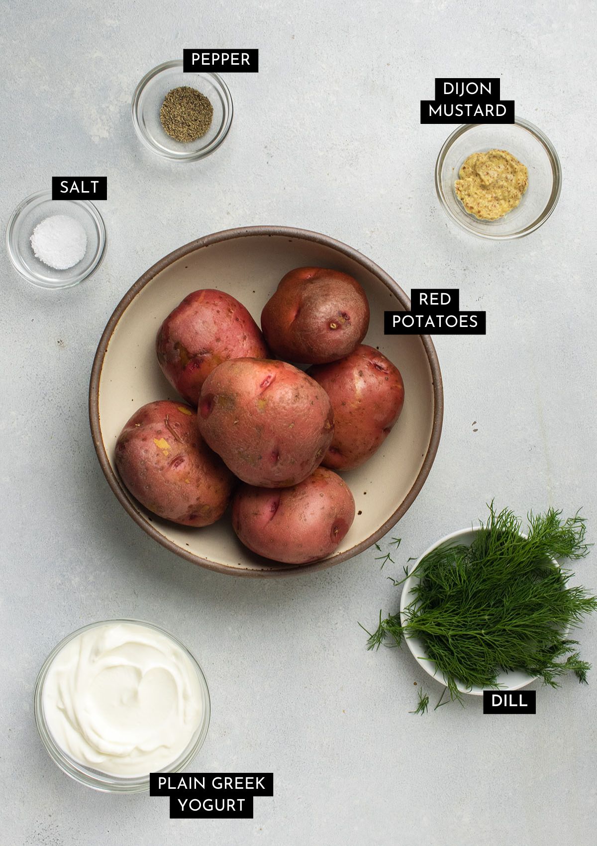 Potato salad ingredients, organized into individual bowls.