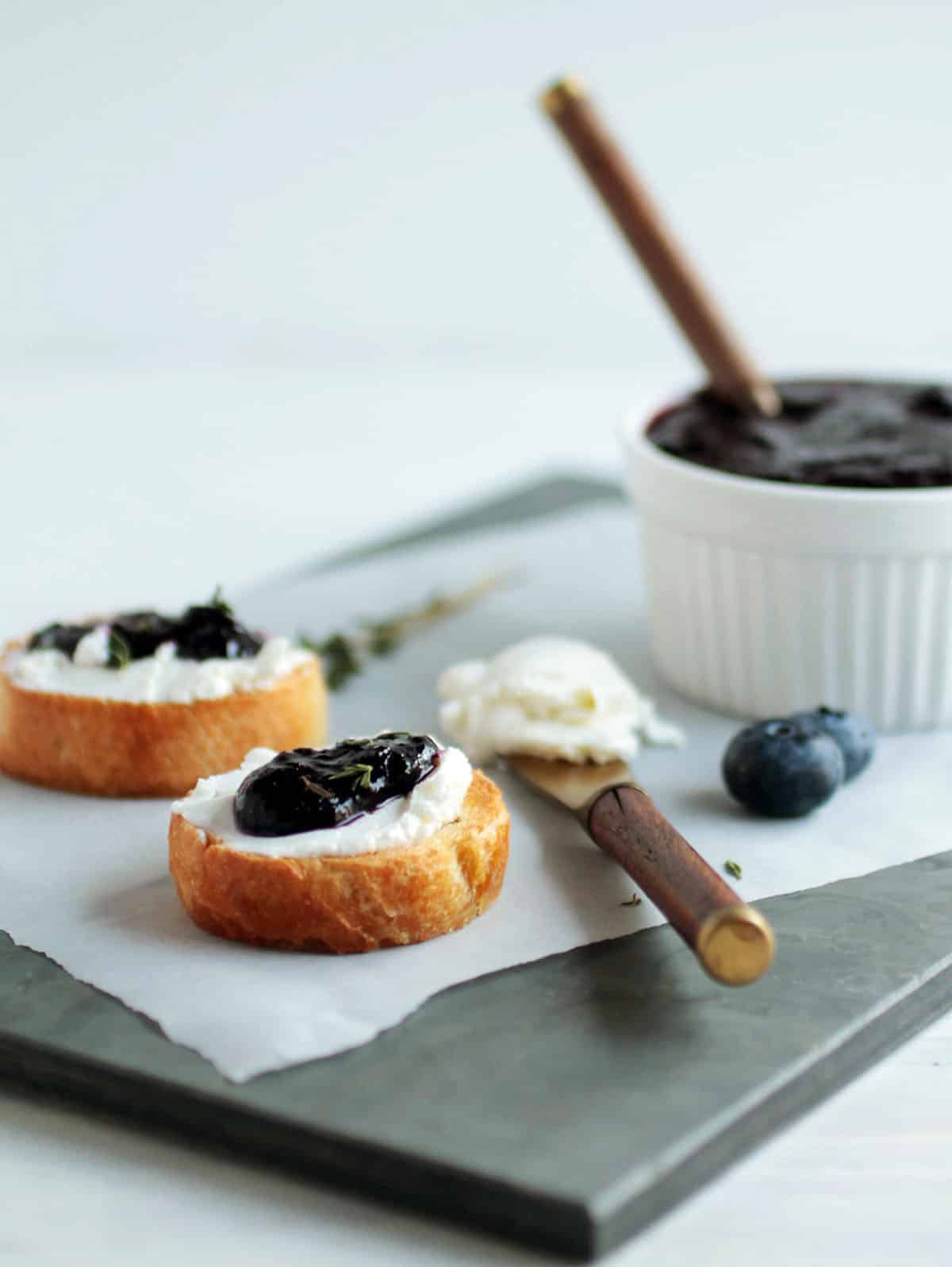 Blueberry jam on crostini with goat cheese.