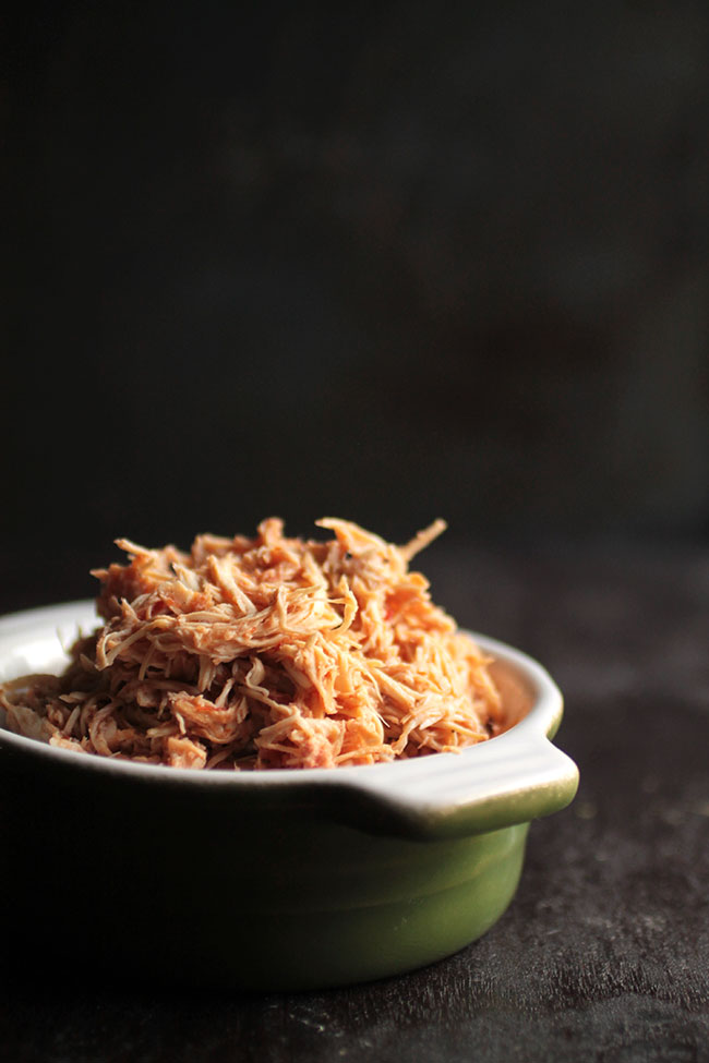 Shredded chicken in a small bowl.