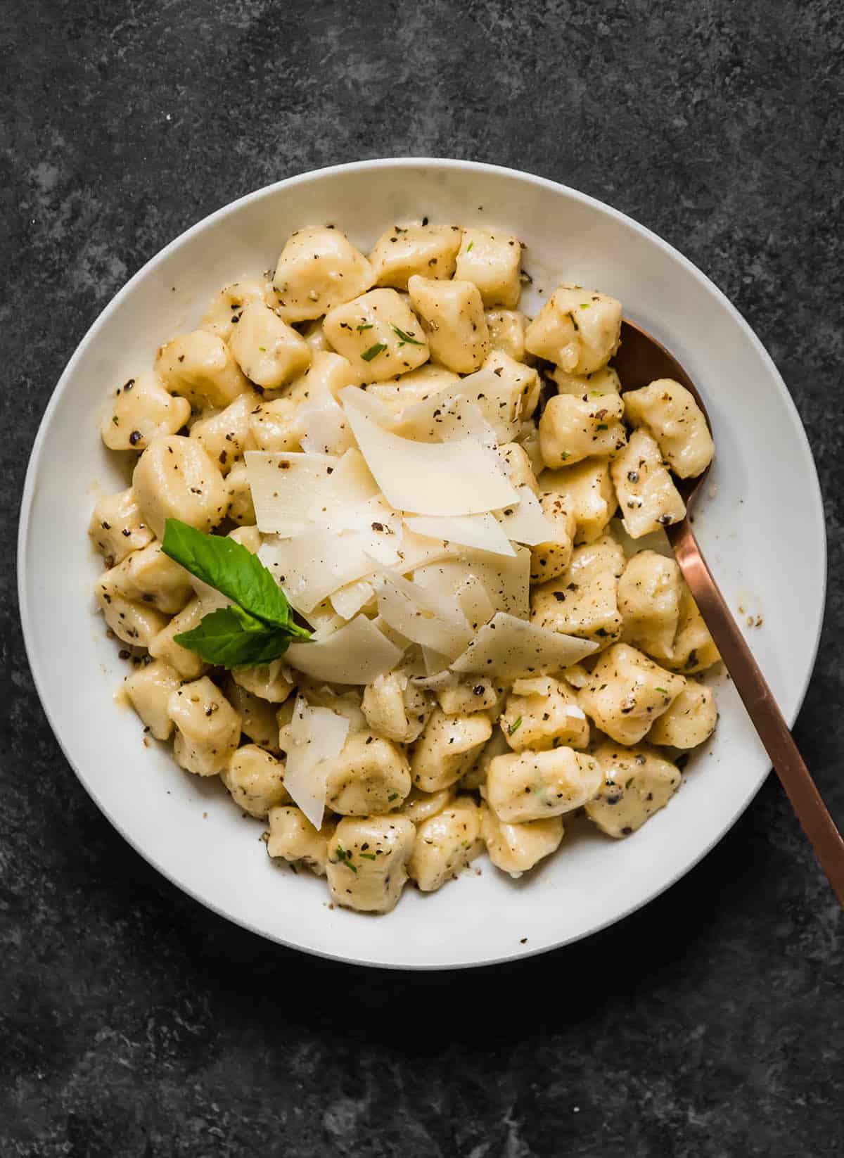 Gnocchi in a shallow white bowl.