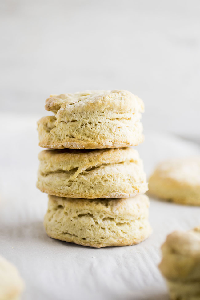 Stack of three biscuits on a white background.