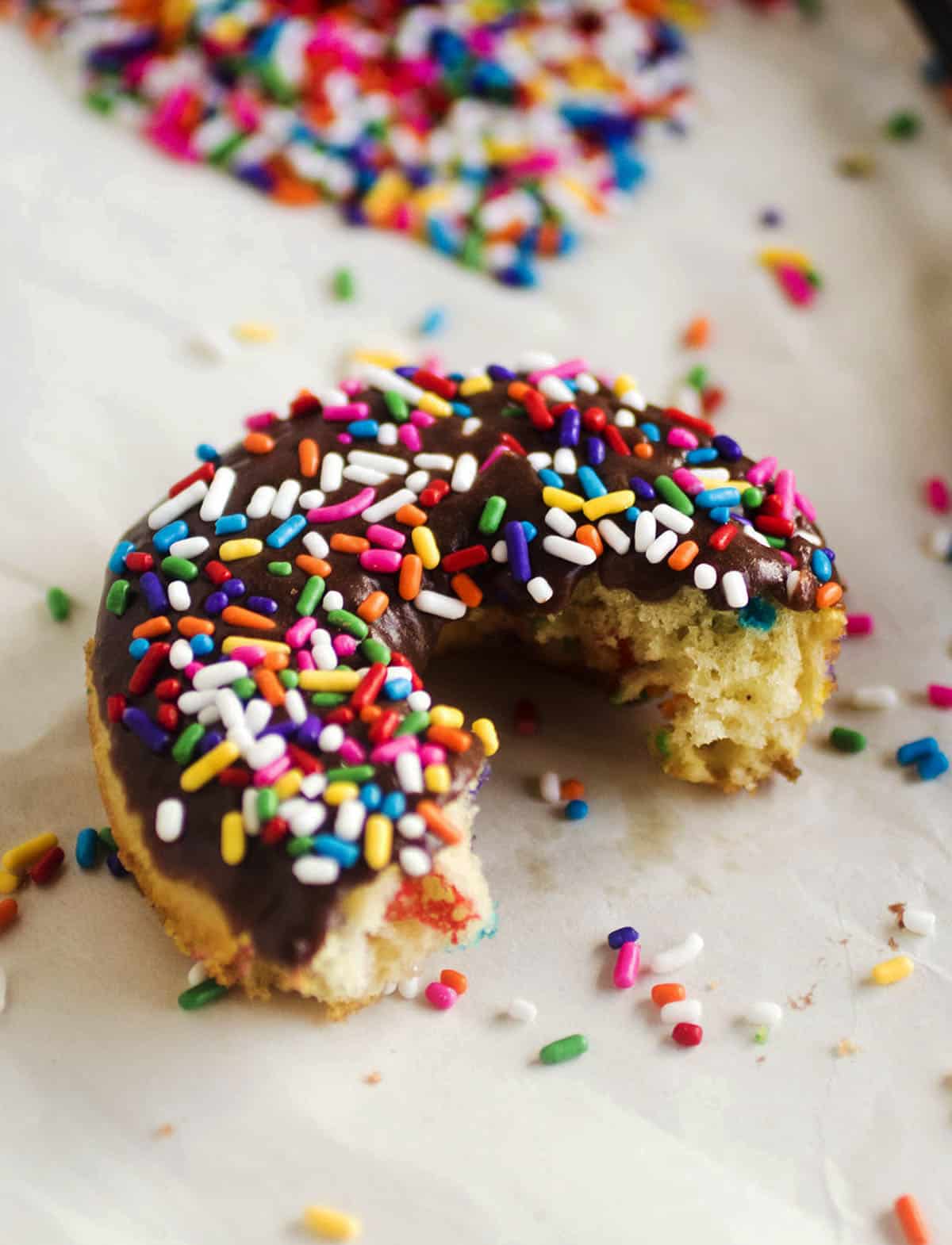 Donut with a bite taken out to show the interior texture.