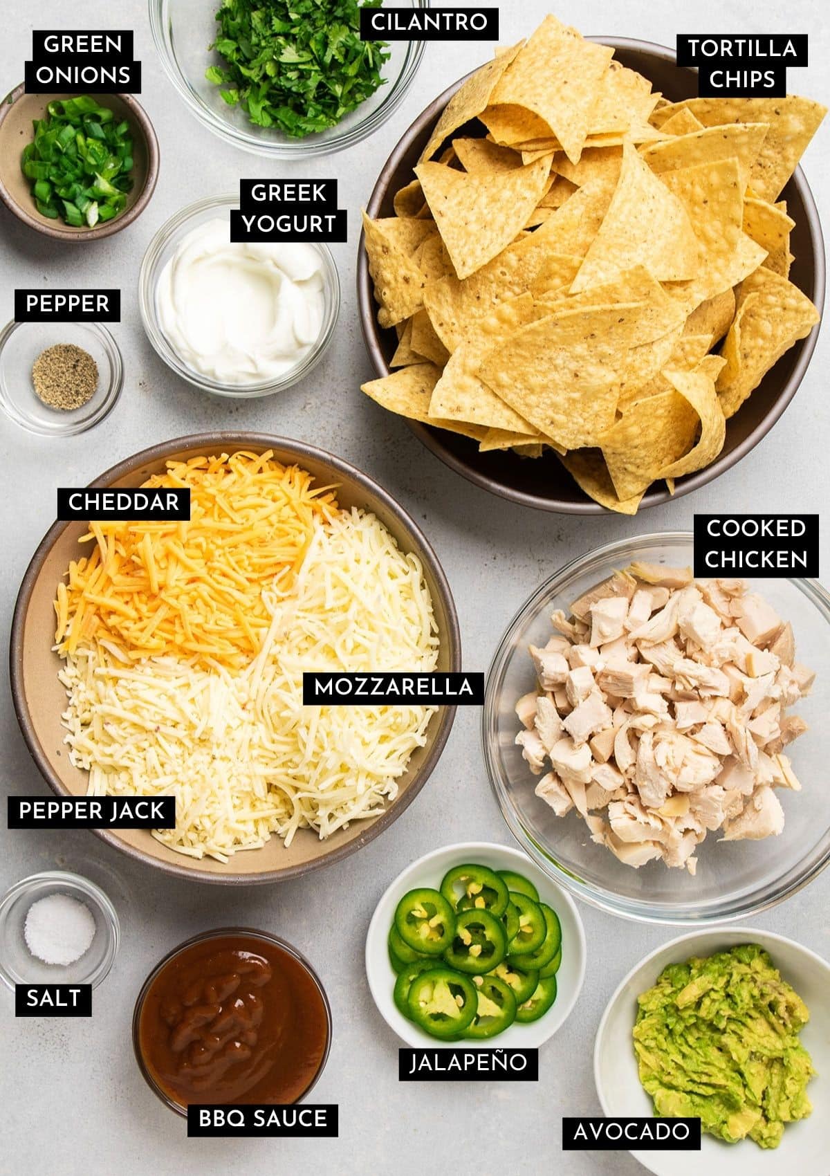 Nachos ingredients, prepped and organized into individual bowls.