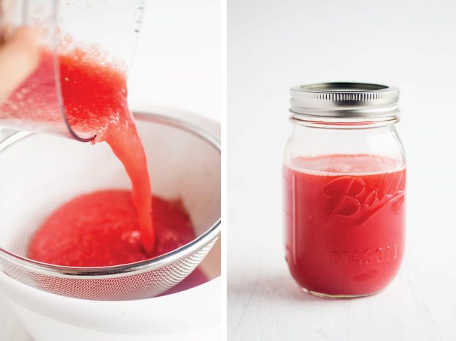 Pouring blended watermelon through a strainer into a mason jar.