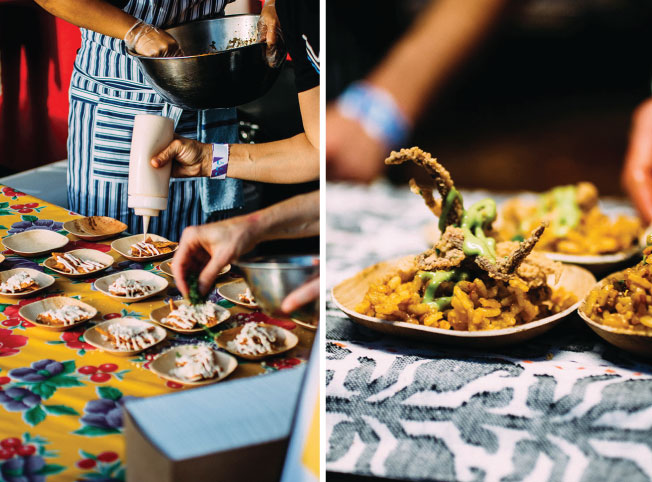 Chefs put the finishing touches on individual plates of nachos.