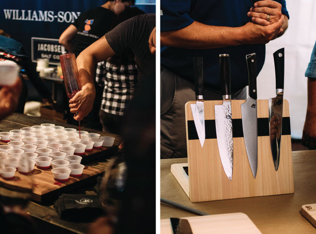 A display of chef knives next to a table of cocktails.
