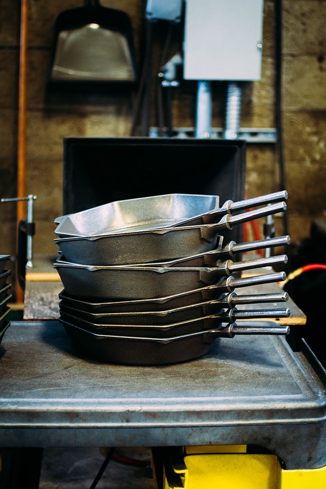 A Stack of freshly made cast iron skillets.