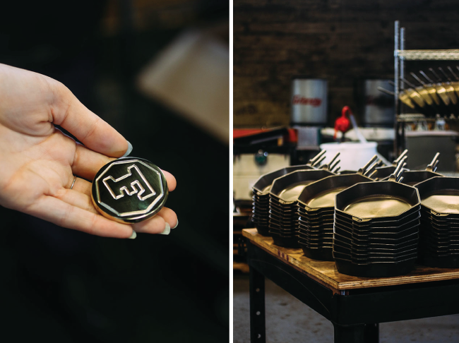 Woman's hand holding a metal Finex logo piece next to a stack of unfinished skillets.