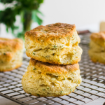 Two biscuits stacked on top of each other on a wire cooling rack.