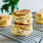 Two biscuits stacked on top of each other on a wire cooling rack.