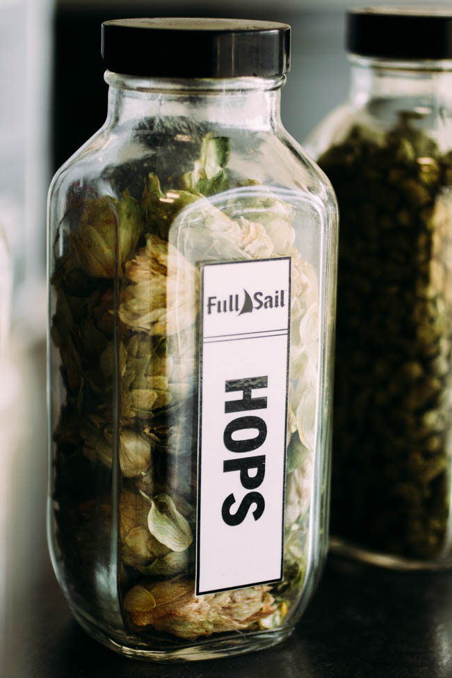Glass jar of fresh hops.