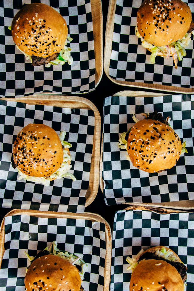 Aerial view of a table full of sliders on checkered plates.