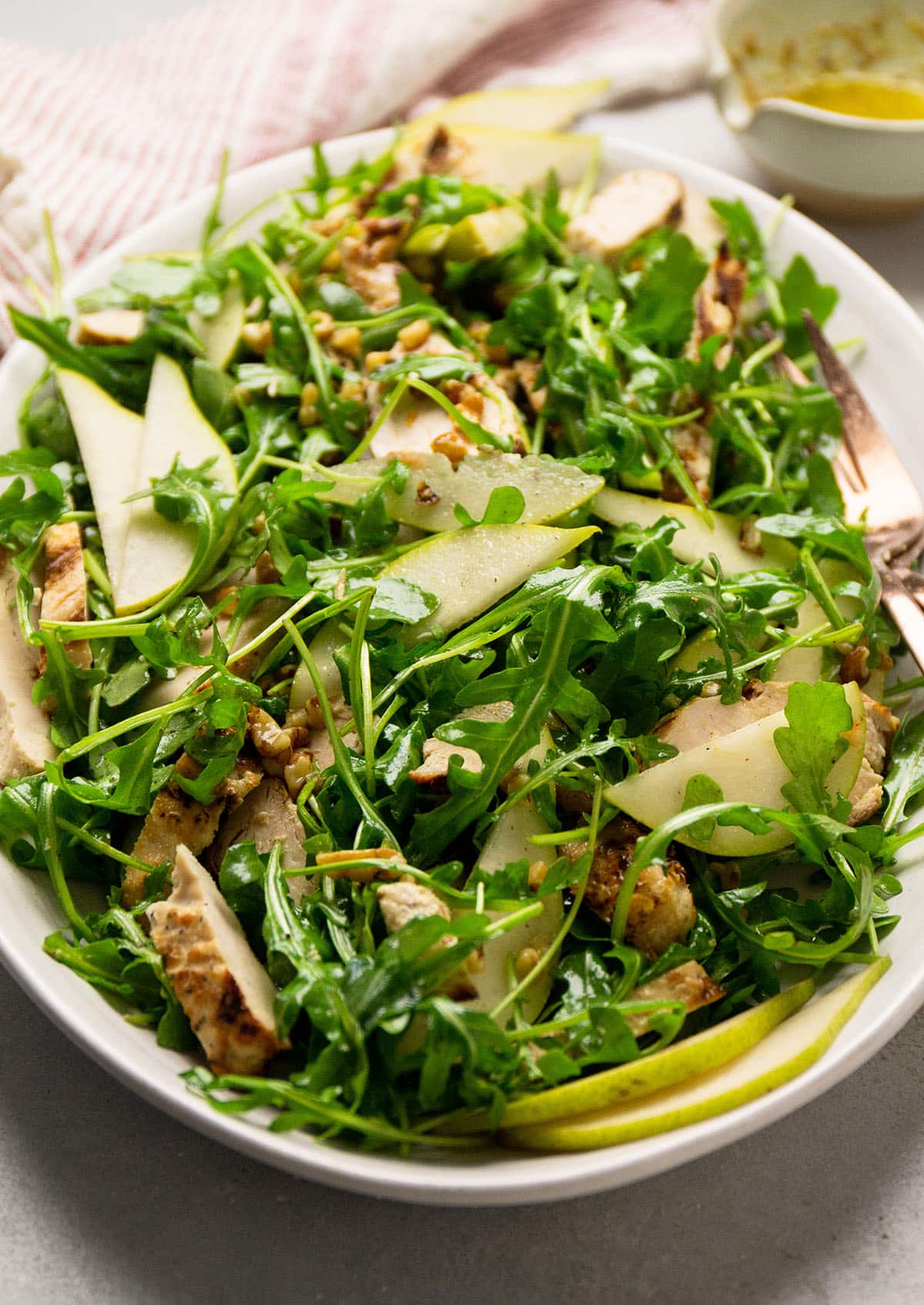 Chicken and arugula salad with lemon dressing.