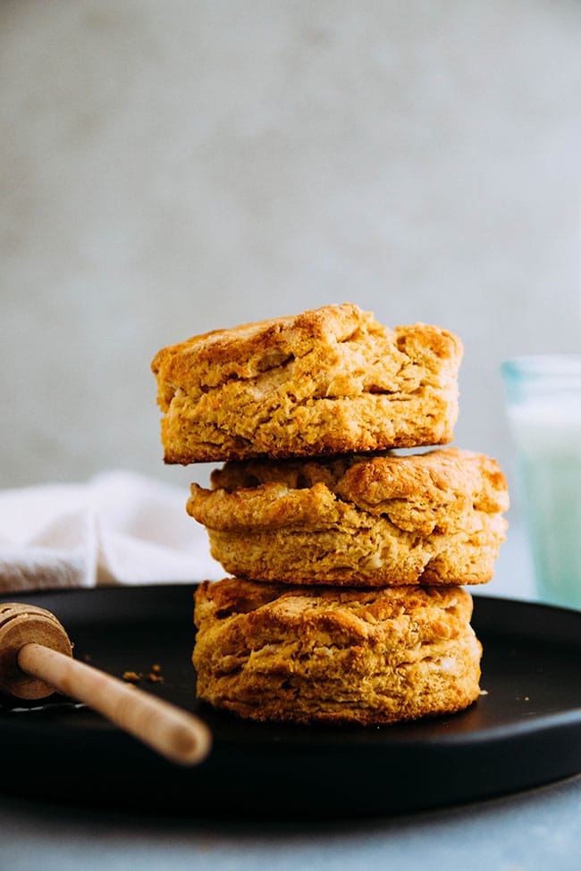 Three sweet potato biscuits stacked on top of each other.
