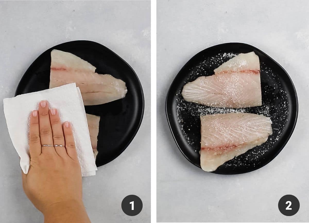 Patting fish dry with a paper towel.