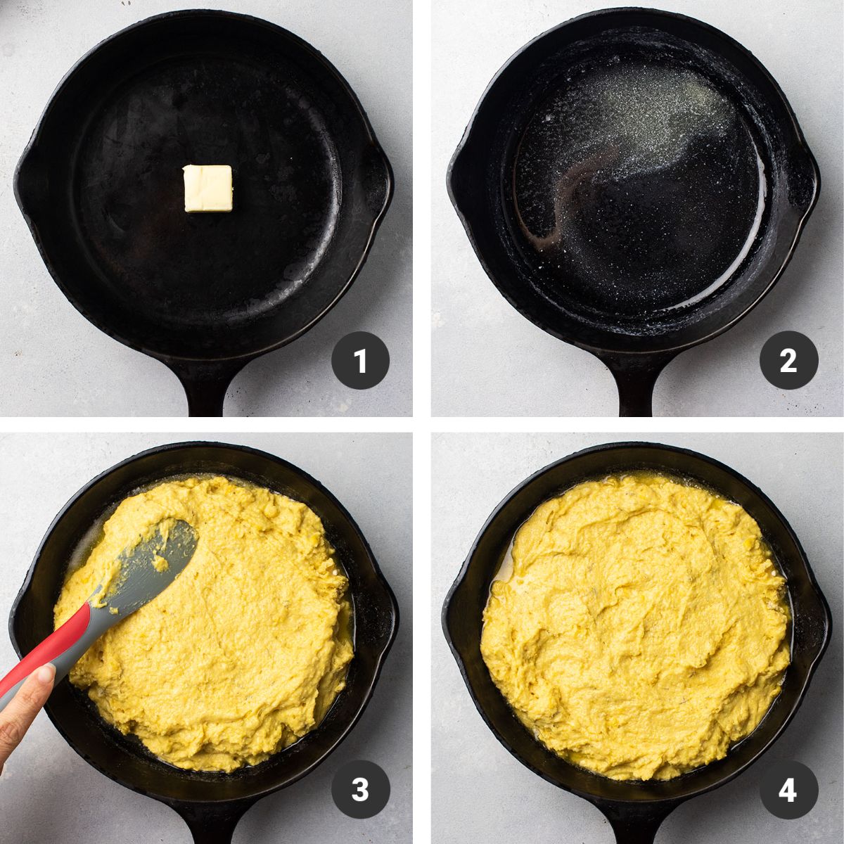 Spreading cornbread batter into cast iron skillet with a red spatula.