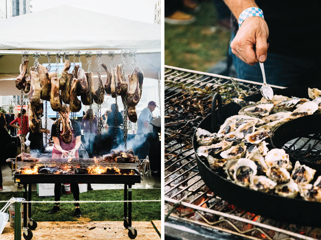 Meat and oysters being cooked on large grills.