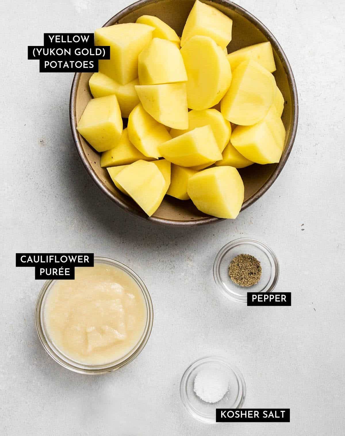 Potatoes and cauliflower cream measured into bowls.