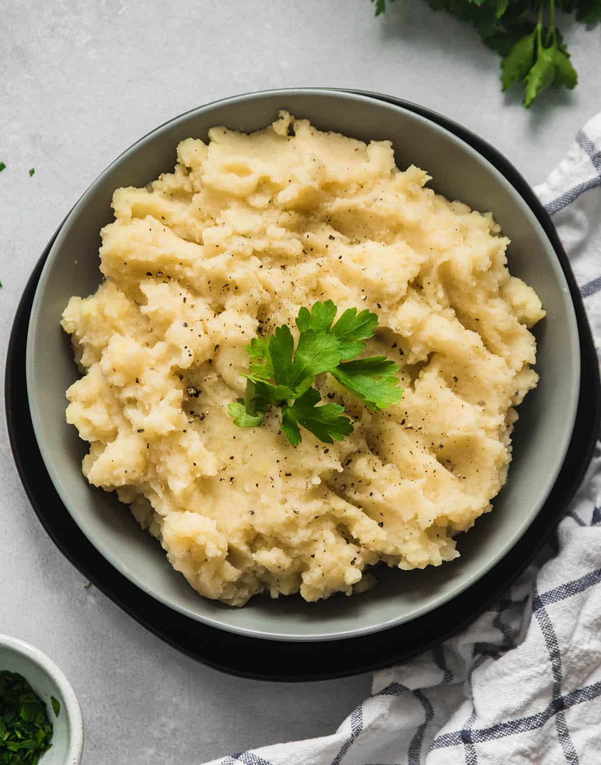 Cauliflower mashed potatoes topped with parsley.