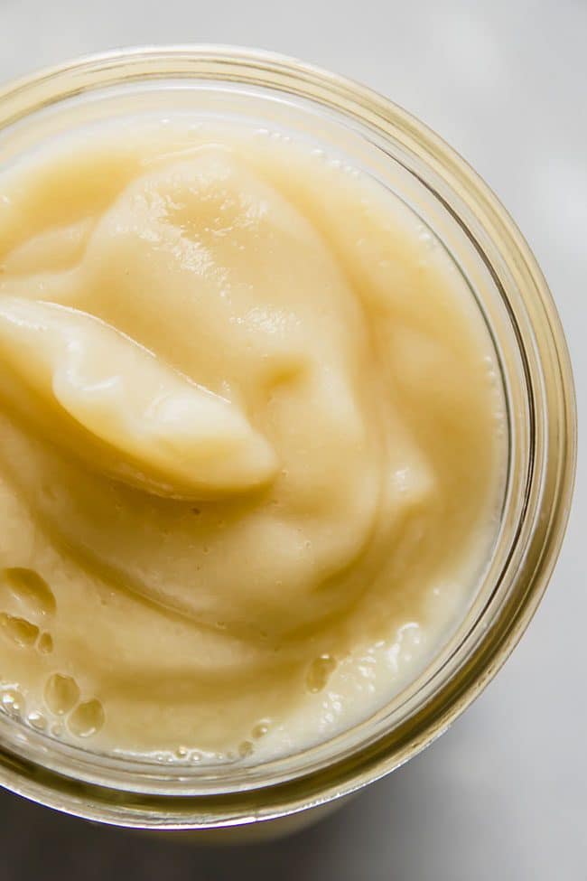 Close up of cauliflower cream sauce in a mason jar.
