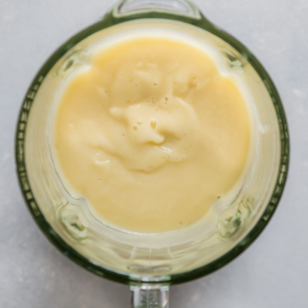 Glass blender filled with puréed cauliflower.