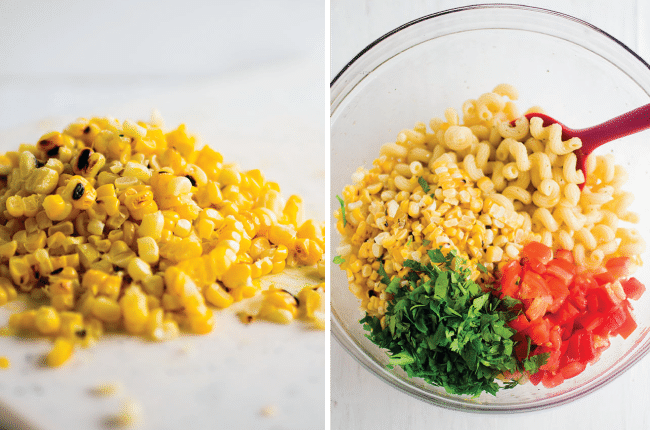 Pasta salad ingredients in a glass mixing bowl.