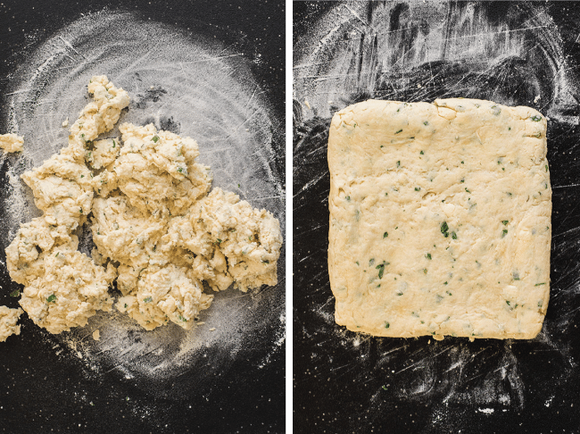 Just-mixed biscuit dough on a black cutting board next to biscuit dough that has been rolled out into a square.