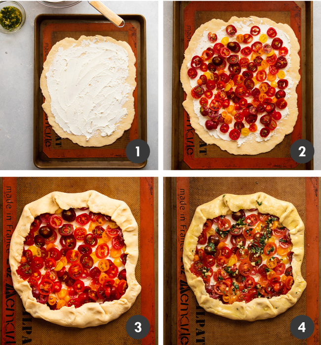 Pie crust being layered with goat cheese and sliced tomatoes to form a galette.