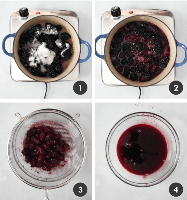 Blackberries and sugar in a small pot, being cooked down into a thick syrup.