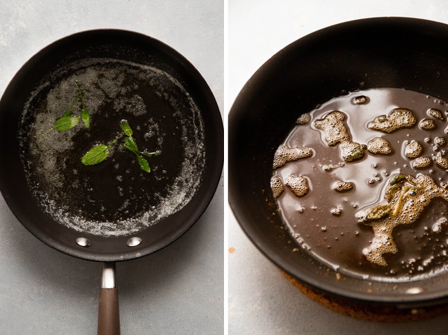 Browned butter with fresh sage leaves in a dark saucepan.