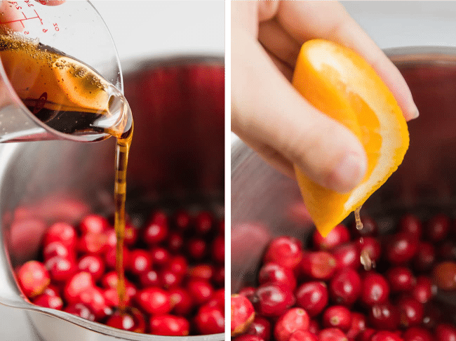 Woman\'s hand pouring maple syrup and orange juice into a saucepan filled with cranberries.