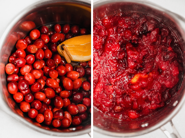 Fresh cranberries in a small saucepan with an orange slice and a cinnamon stick.