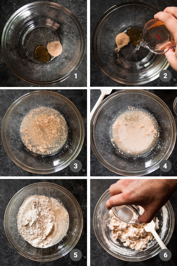 Mixing bread dough in a glass bowl on a dark table.