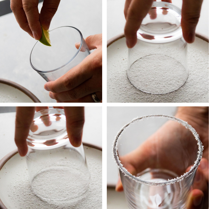 Dipping a cocktail glass in salt to form a salt rim.